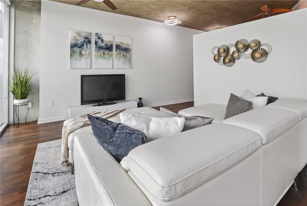 3324 Peachtree Road Northeast, Unit 1312 Atlanta, GA 30326 - Photo 20 of 23 a living room with furniture and a flat screen tv