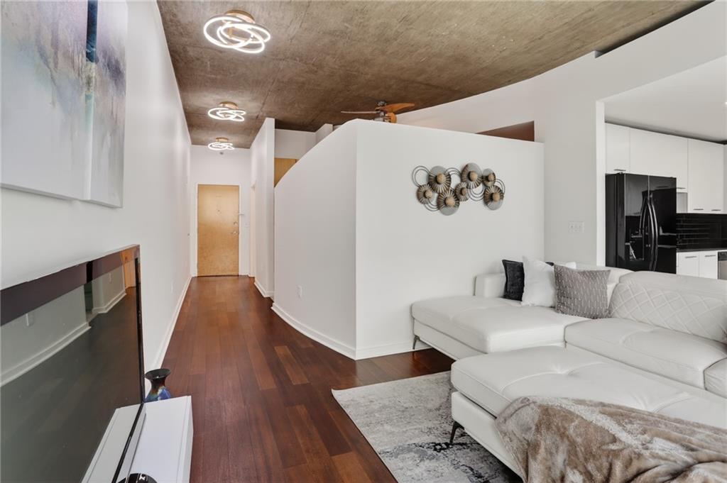 3324 Peachtree Road Northeast, Unit 1312 Atlanta, GA 30326 - Photo 21 of 23 a living room with furniture and a rug