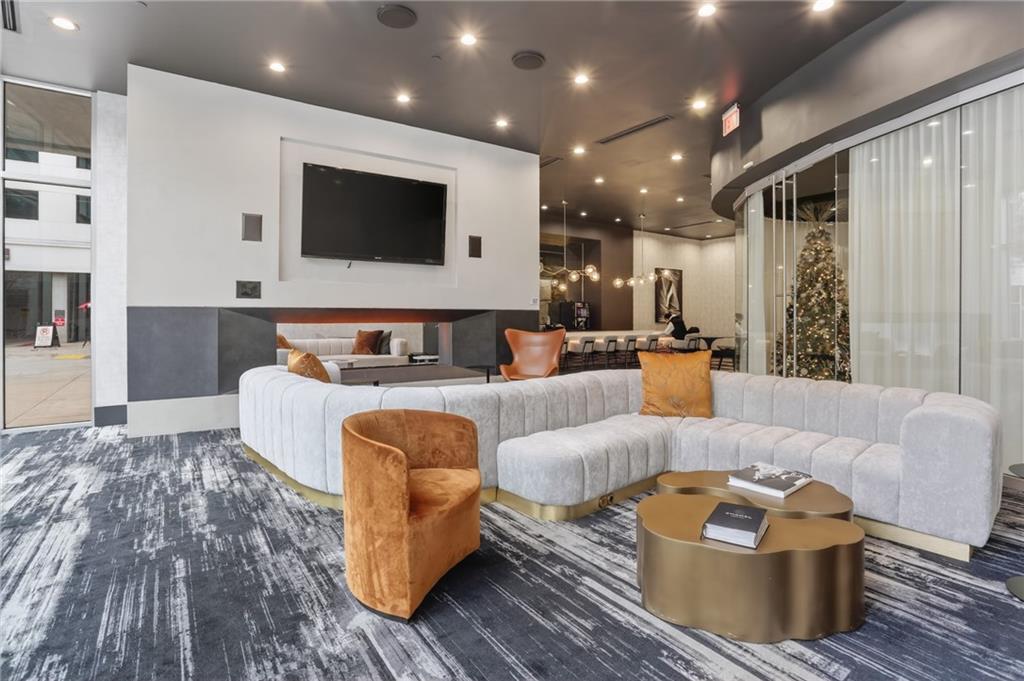 3324 Peachtree Road Northeast, Unit 1312 Atlanta, GA 30326 - Photo 4 of 23 a living room with furniture and a flat screen tv