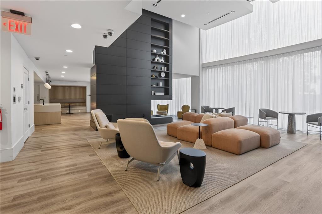 3324 Peachtree Road Northeast, Unit 1312 Atlanta, GA 30326 - Photo 7 of 23 a living room with furniture and a large window