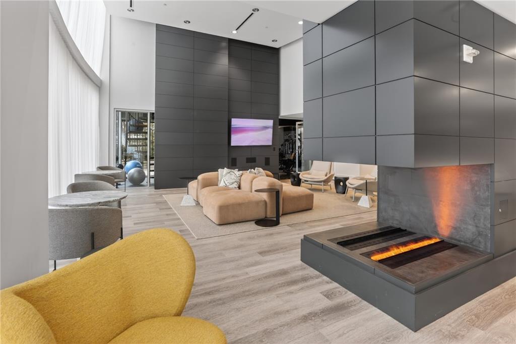 3324 Peachtree Road Northeast, Unit 1312 Atlanta, GA 30326 - Photo 8 of 23 a living room with furniture and a rug