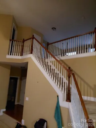 a kitchen with kitchen island granite countertop wooden cabinets a refrigerator and a stove