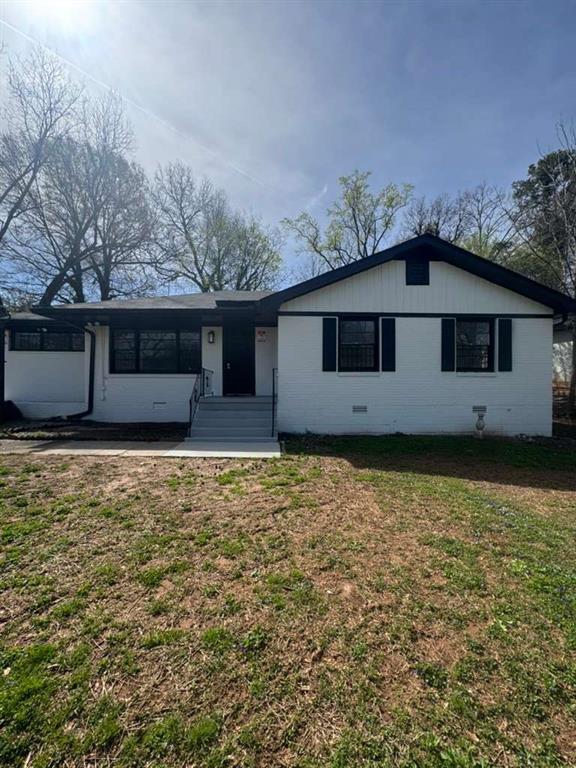 a house with trees in the background