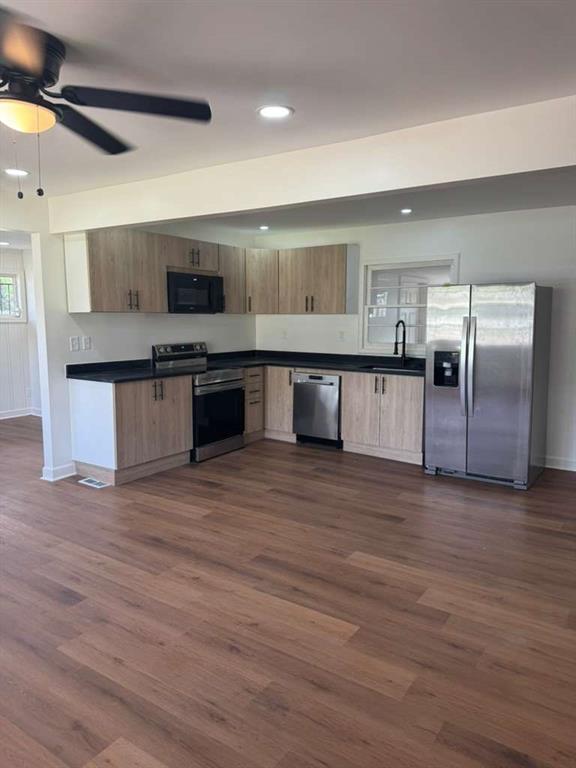 3005 Belvedere Lane Decatur, GA 30032 - Photo 15 of 16 a large kitchen with stainless steel appliances a large counter top and stove top oven