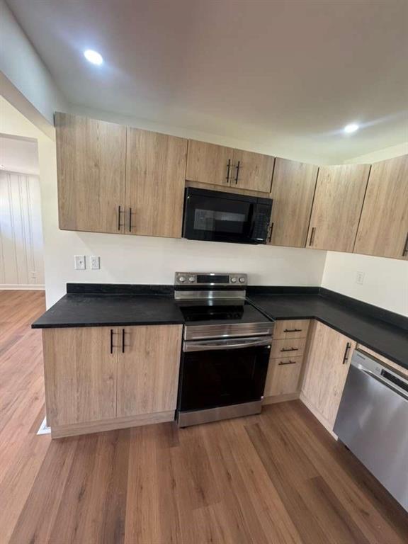 3005 Belvedere Lane Decatur, GA 30032 - Photo 16 of 16 a kitchen with stainless steel appliances kitchen island granite countertop a stove a sink and a microwave