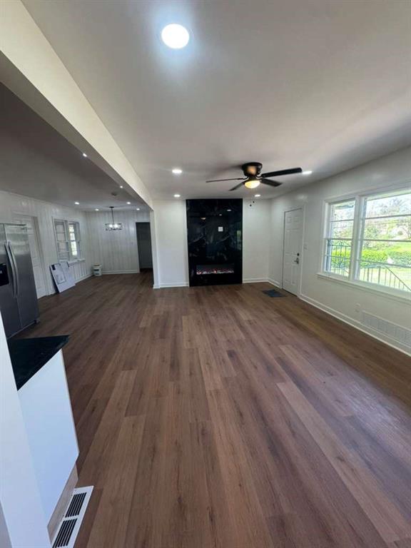 3005 Belvedere Lane Decatur, GA 30032 - Photo 3 of 16 an empty room with wooden floor and windows