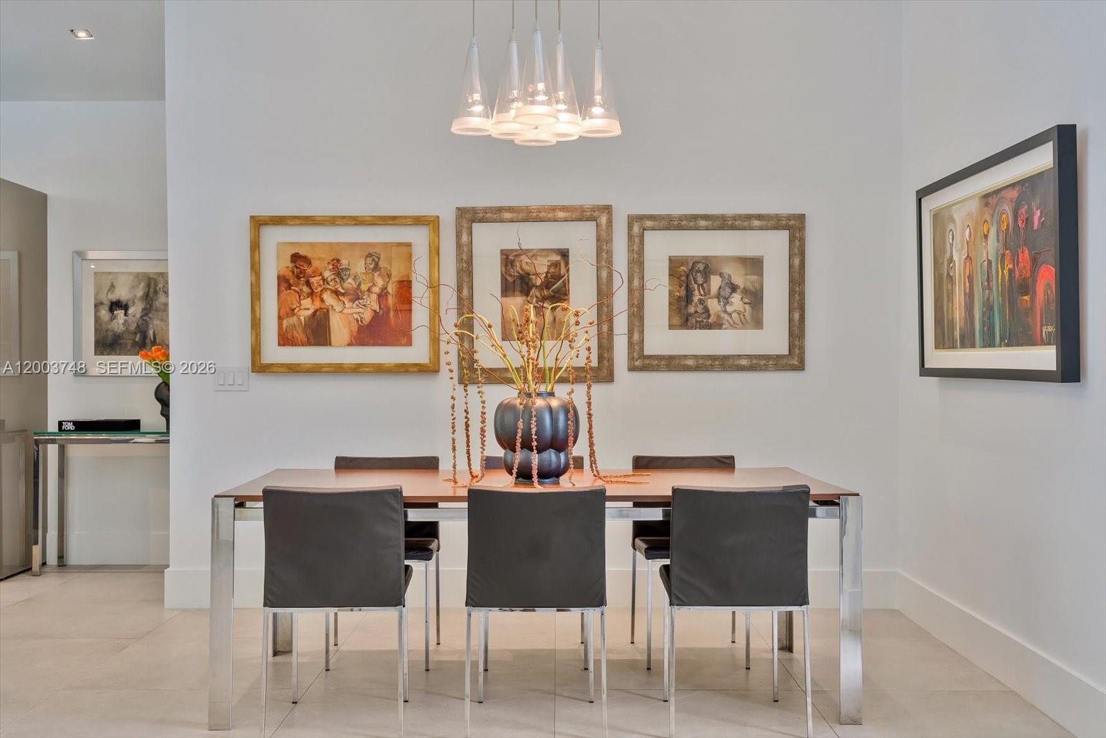 2675 Hackney Road Weston, FL 33331 - Photo 19 of 61 a dining room with furniture and chandelier