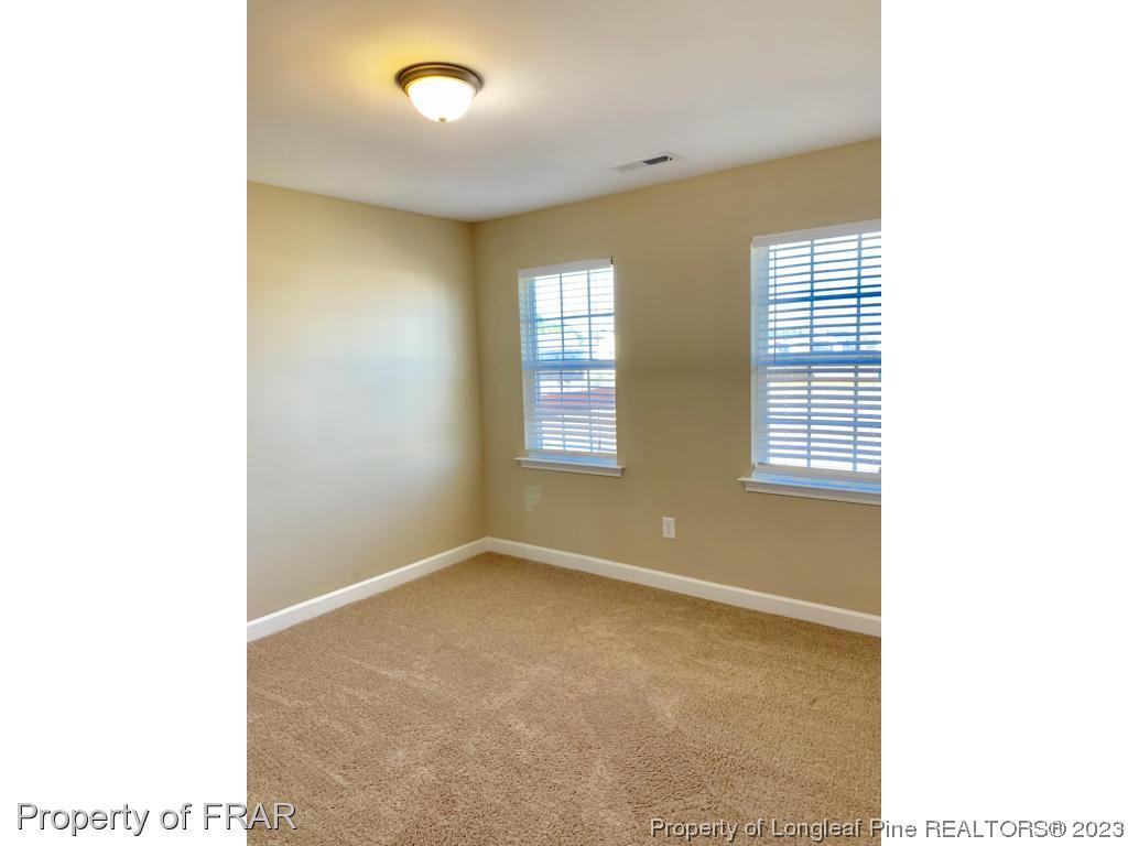 211 Rainmaker Street Linden, NC 28356 - Photo 19 of 34 a view of an empty room with a window