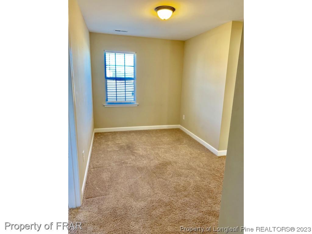 211 Rainmaker Street Linden, NC 28356 - Photo 21 of 34 a view of an empty room with windows