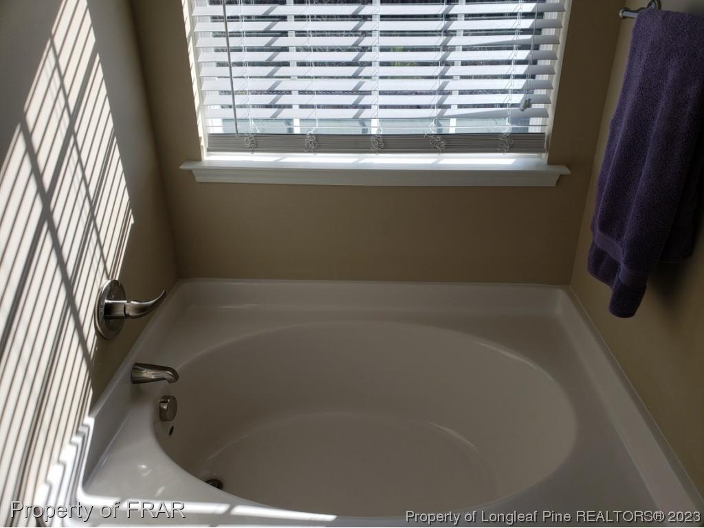 211 Rainmaker Street Linden, NC 28356 - Photo 27 of 34 a bathroom with a bathtub