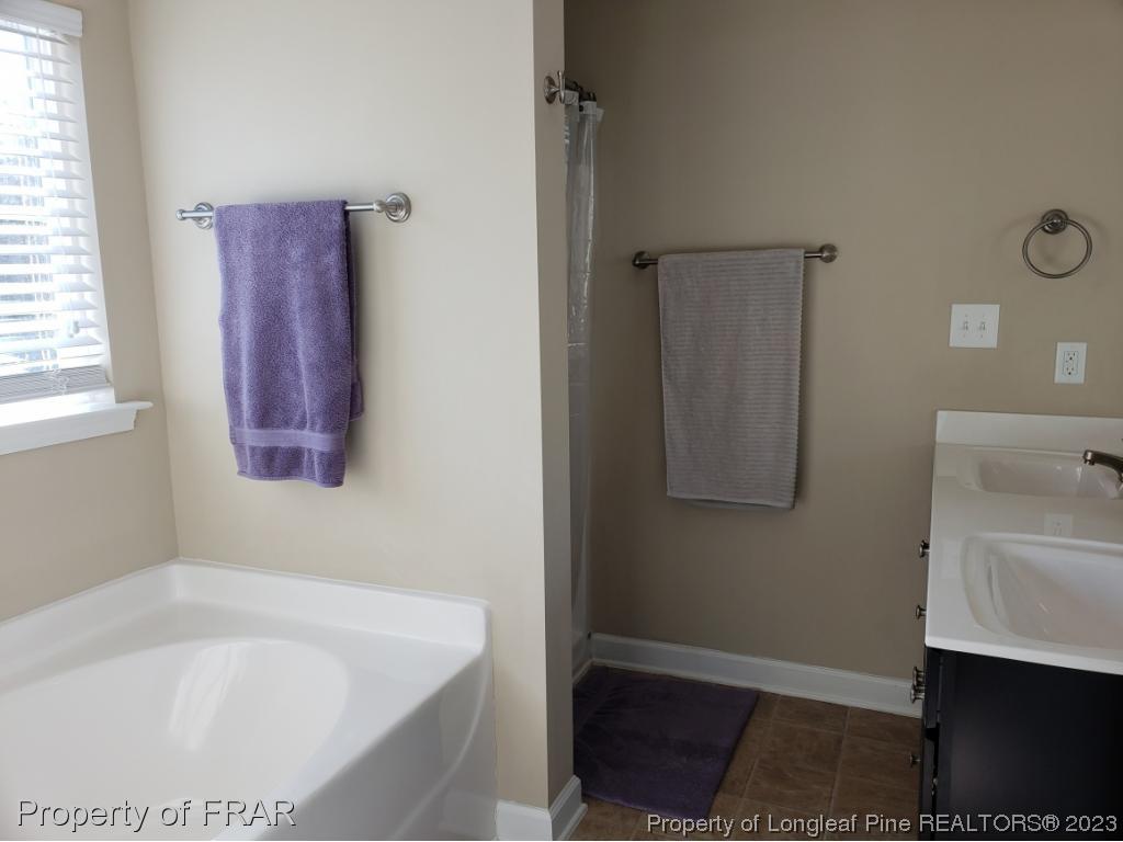 211 Rainmaker Street Linden, NC 28356 - Photo 28 of 34 a bathroom with a bathtub