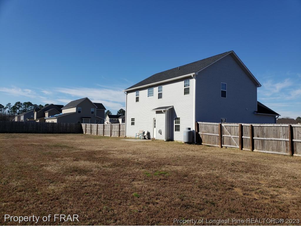 211 Rainmaker Street Linden, NC 28356 - Photo 30 of 34 a front view of house with yard and car parked