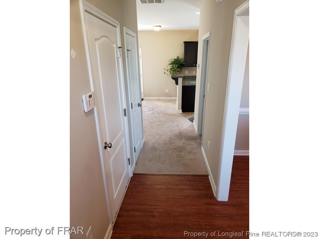 211 Rainmaker Street Linden, NC 28356 - Photo 3 of 34 a view of a hallway with wooden floor
