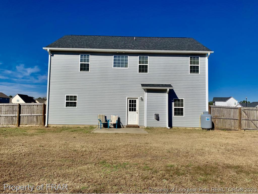 211 Rainmaker Street Linden, NC 28356 - Photo 31 of 34 a view of a house with large windows
