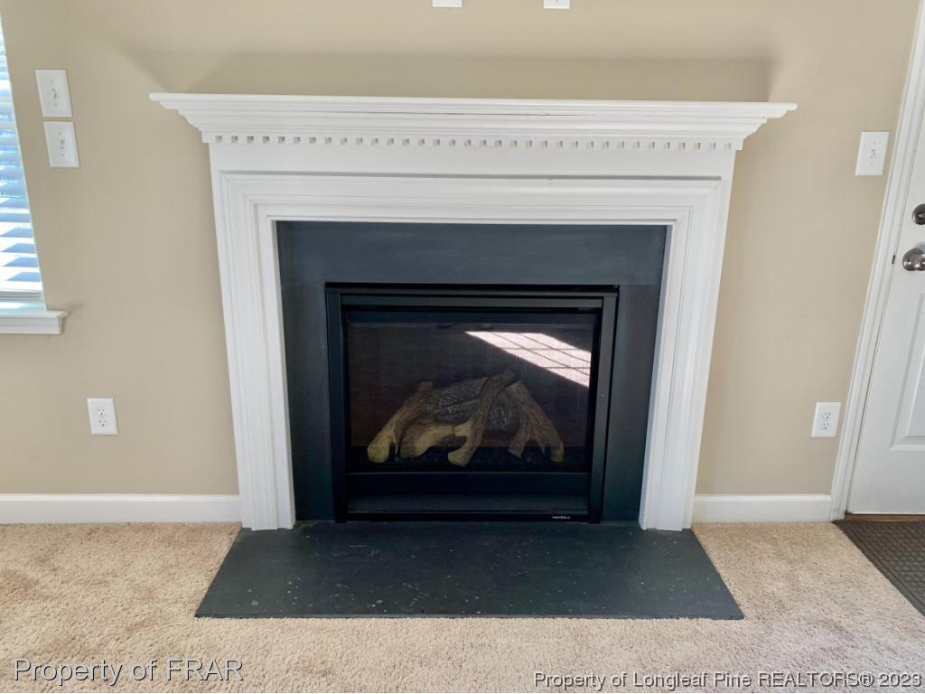 211 Rainmaker Street Linden, NC 28356 - Photo 6 of 34 a living room with a fireplace