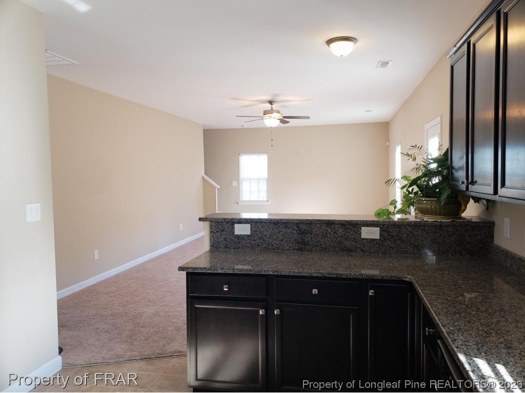 211 Rainmaker Street Linden, NC 28356 - Photo 10 of 34 a kitchen with a sink and a refrigerator