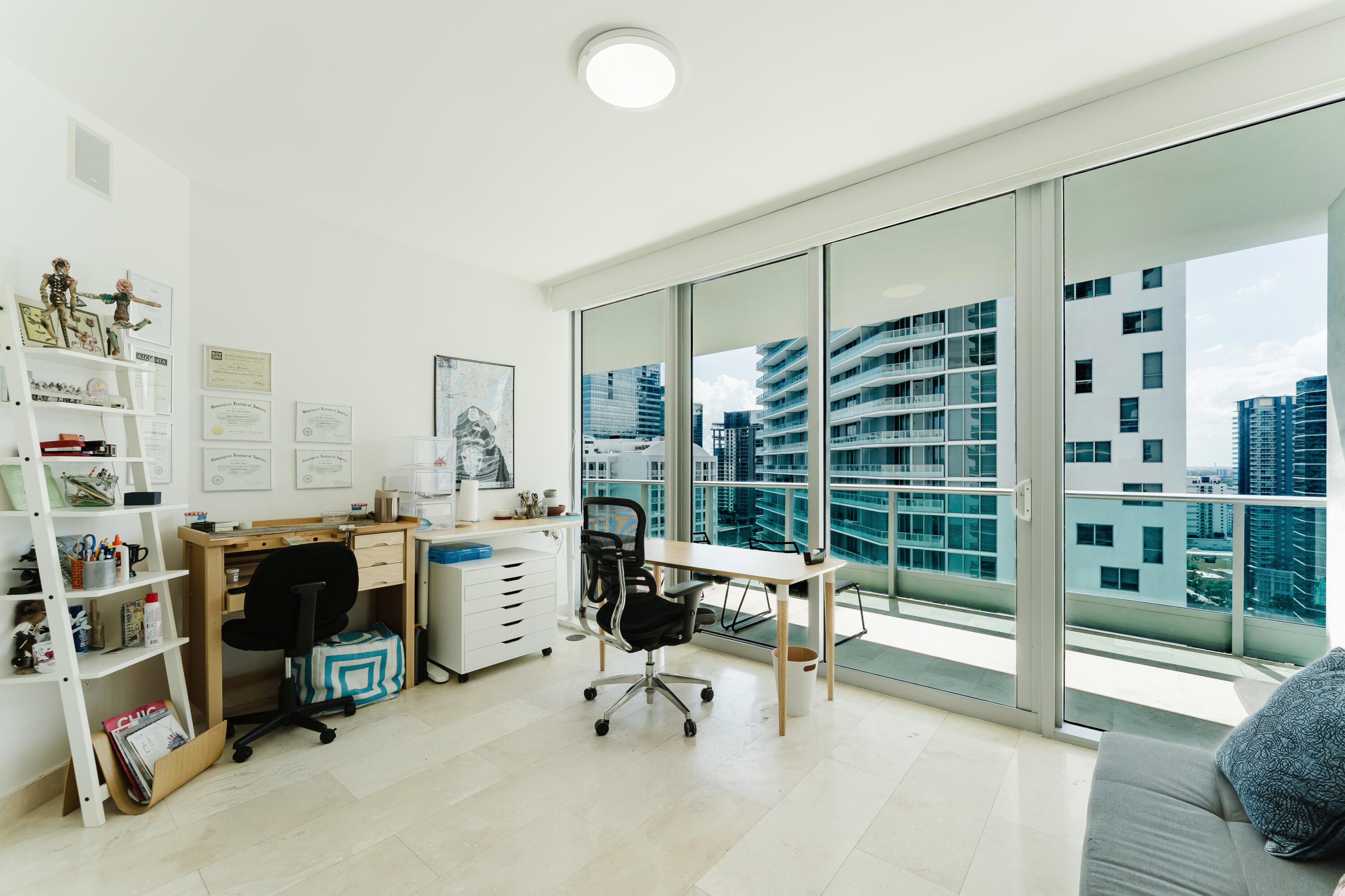1331 Brickell Bay Drive, Unit 2805 Miami, FL 33131 - Photo 11 of 30 a view of a livingroom with workspace and windows
