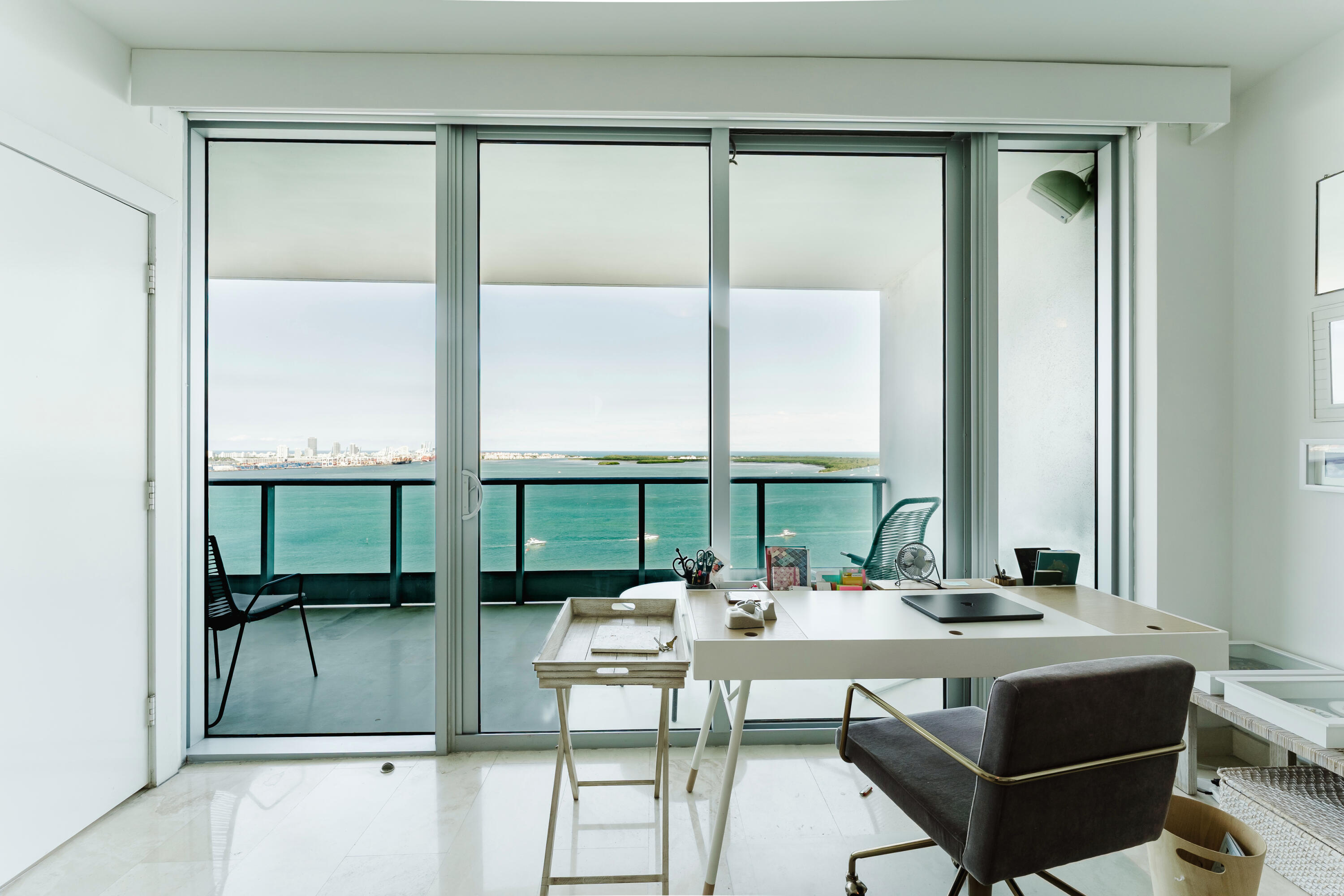 1331 Brickell Bay Drive, Unit 2805 Miami, FL 33131 - Photo 12 of 30 a table and chairs in the balcony