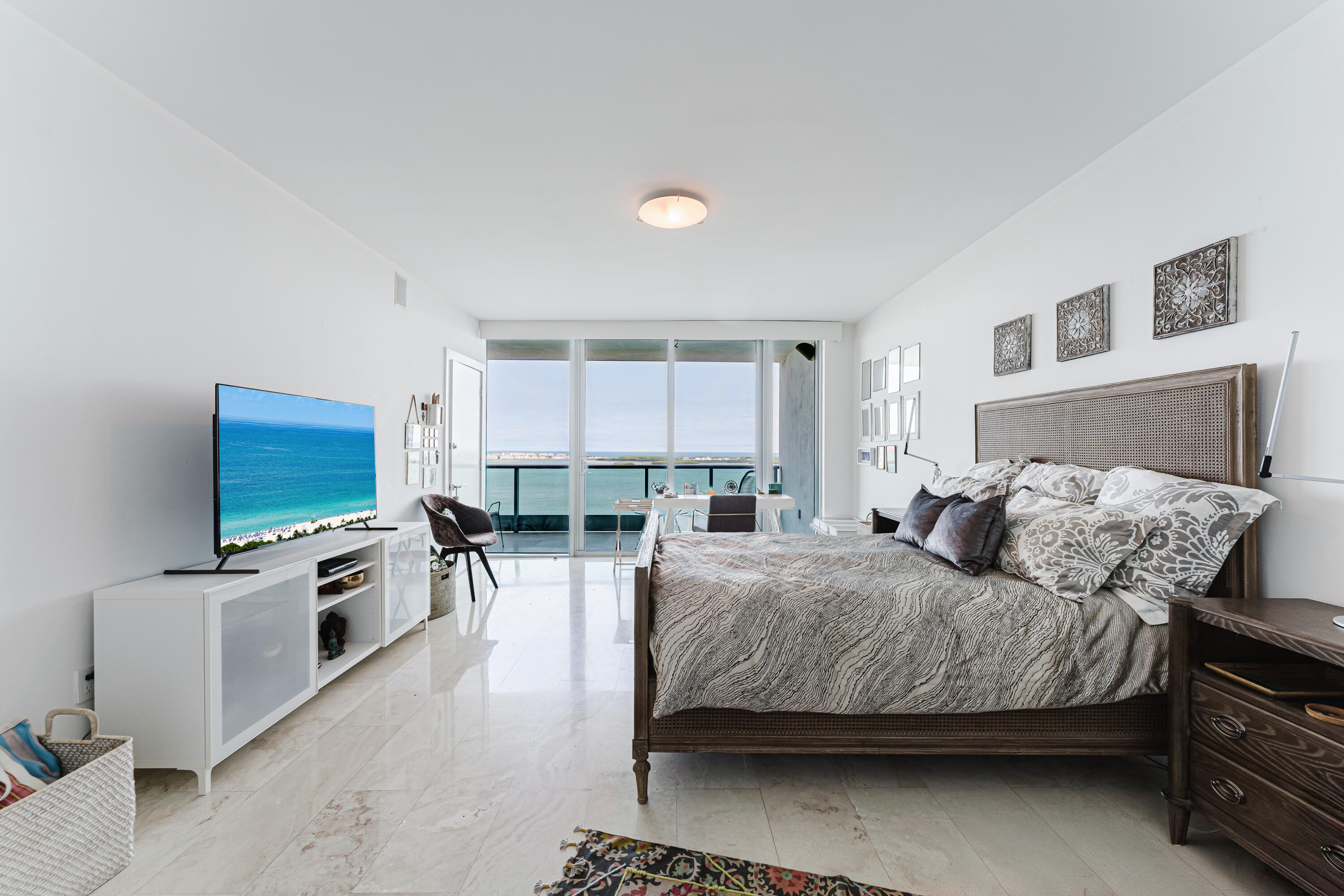 1331 Brickell Bay Drive, Unit 2805 Miami, FL 33131 - Photo 13 of 30 a bedroom with a bed and a flat screen tv
