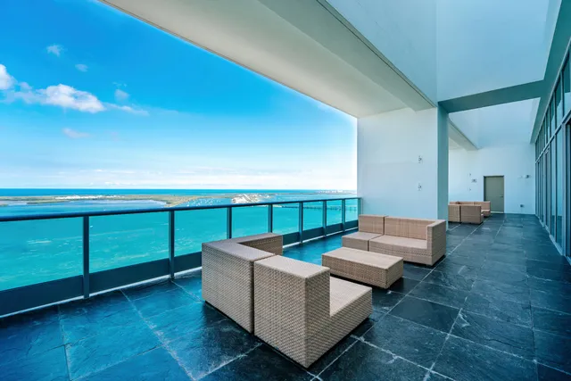 a living room with furniture and a gate