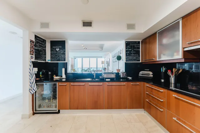 a kitchen with stainless steel appliances granite countertop a stove and cabinets