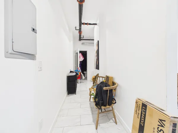 a room with furniture and a mirror