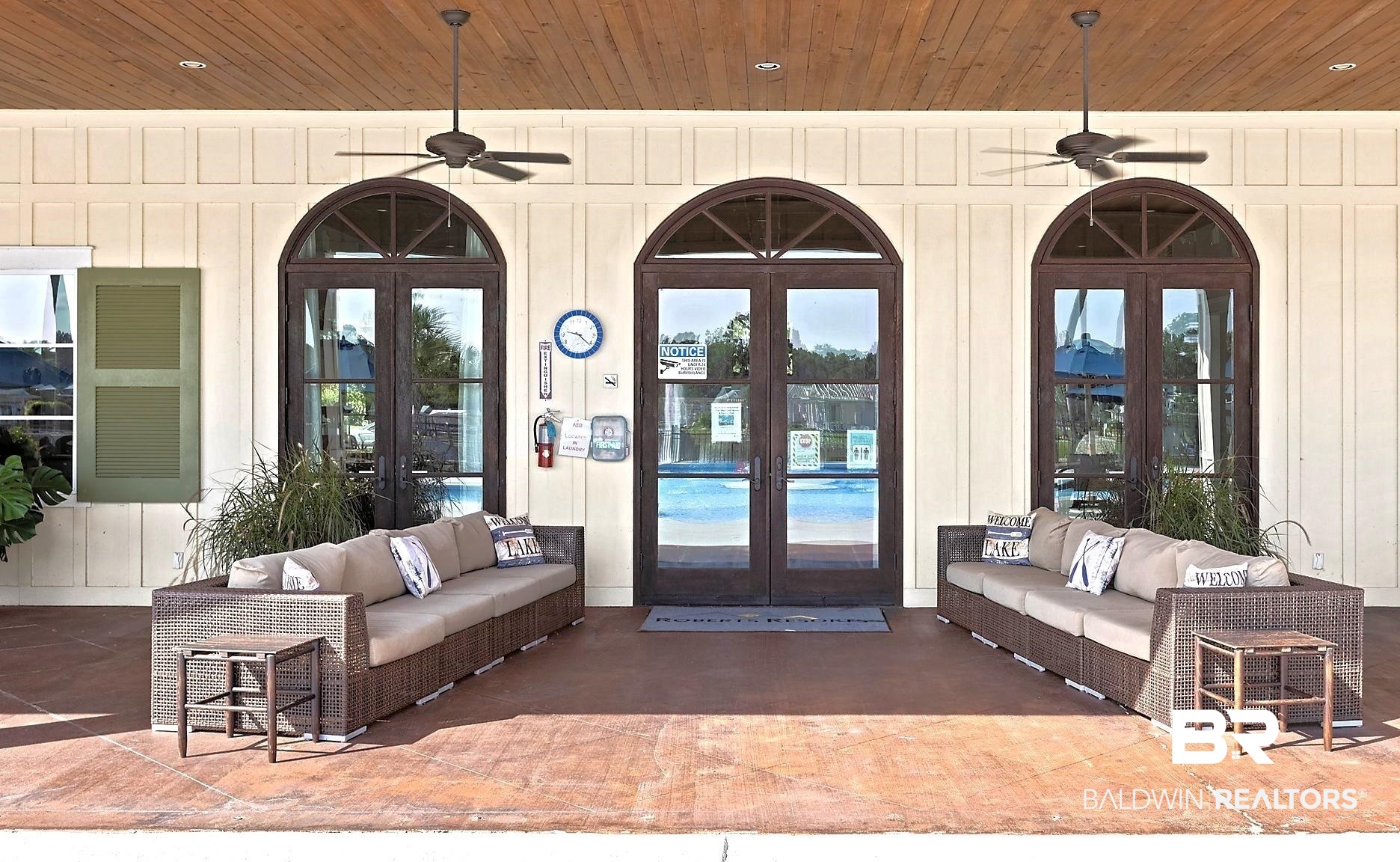 12377 Gateway Drive Elberta, AL 36530 - Photo 38 of 64 View of exterior entry featuring an outdoor living space, french doors, and a ceiling fan