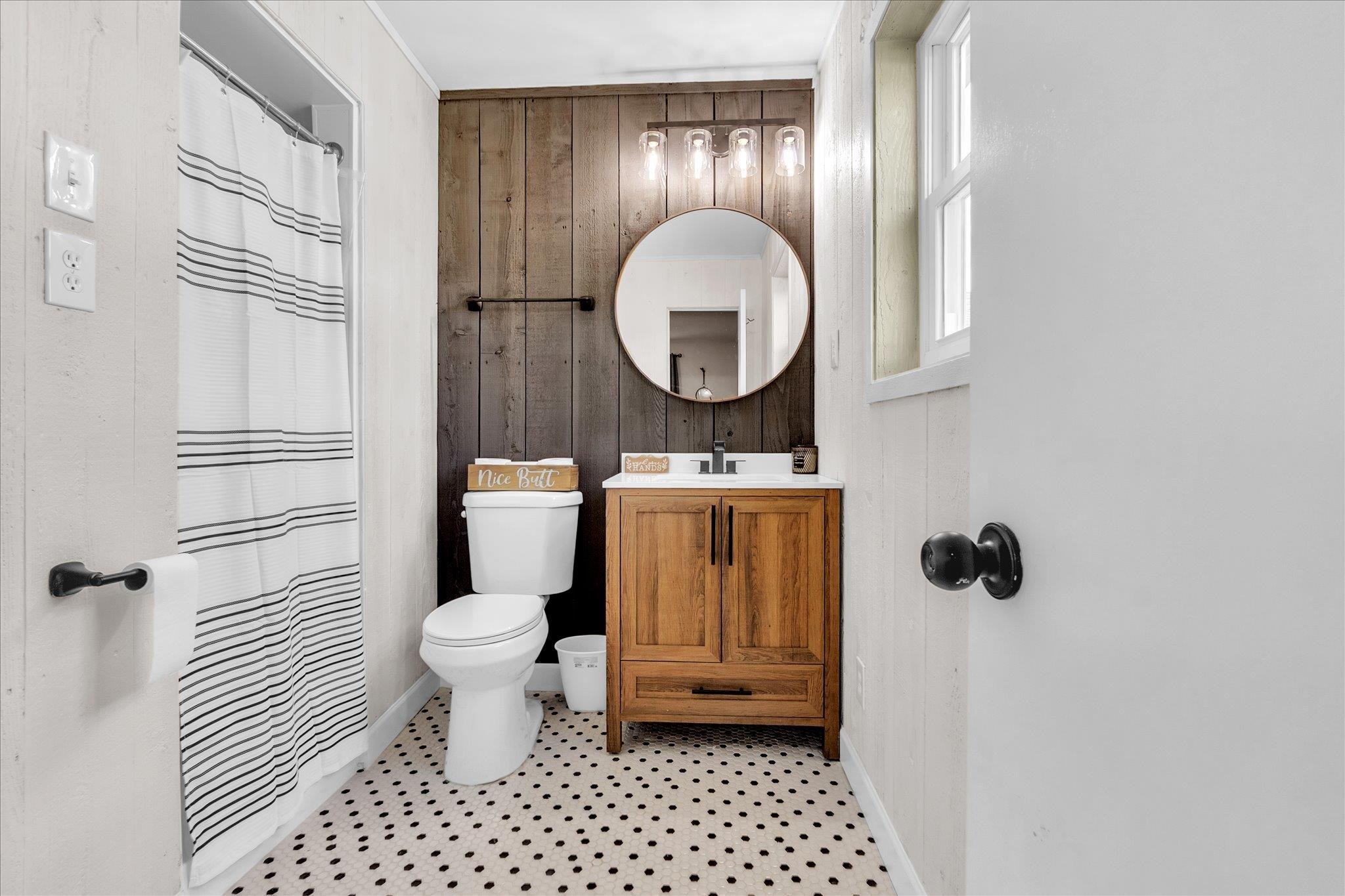 885 Rebel Road Piperton, TN 38017 - Photo 13 of 30 Bathroom featuring wood walls, vanity, and curtained shower
