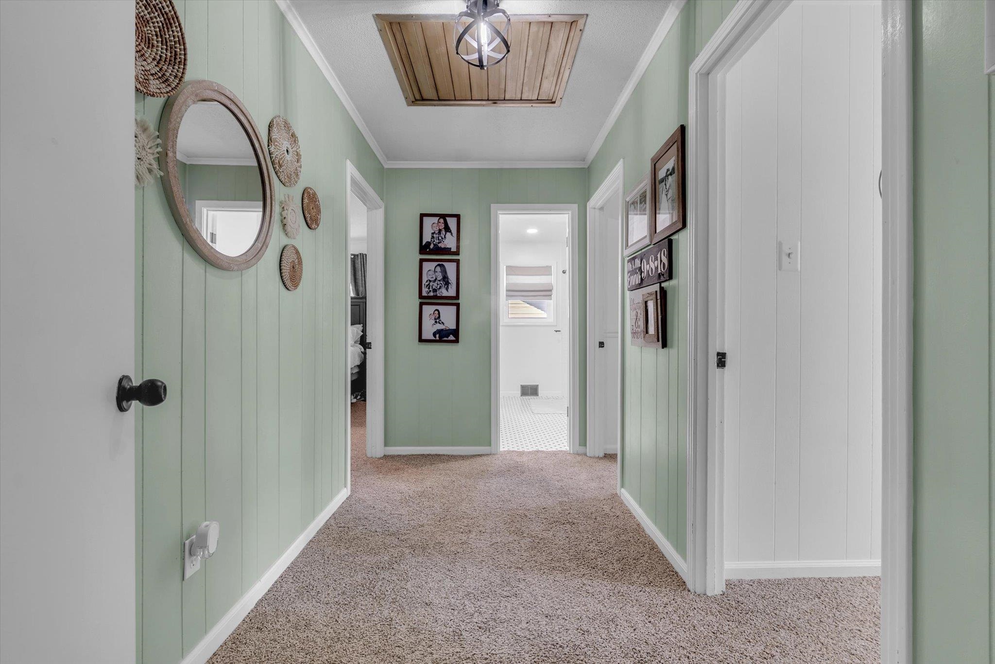 885 Rebel Road Piperton, TN 38017 - Photo 14 of 30 Hallway with cooling unit, crown molding, and light colored carpet