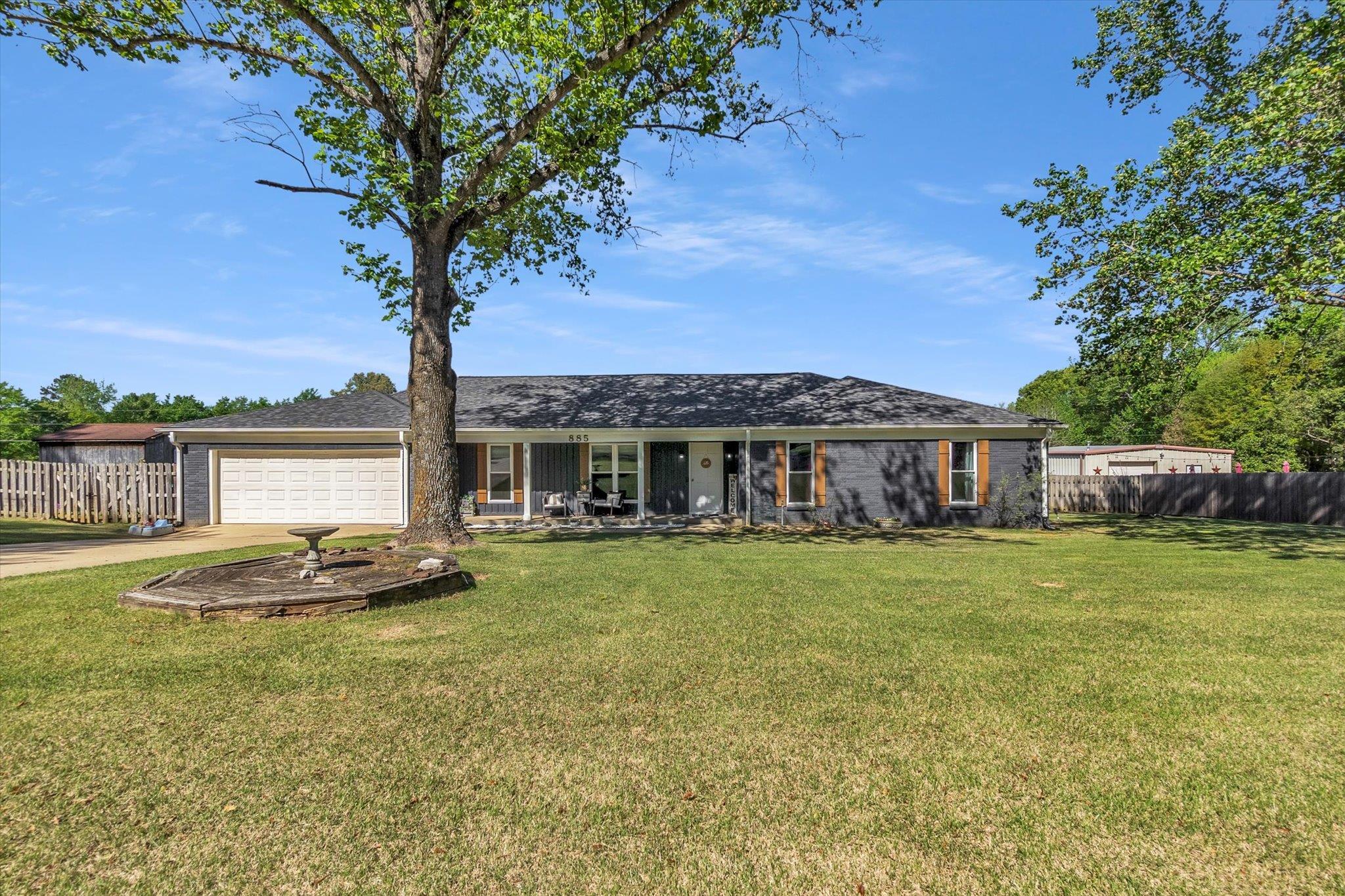 885 Rebel Road Piperton, TN 38017 - Photo 2 of 30 View of front of house with driveway, brick siding, a garage, covered porch, and a shingled roof