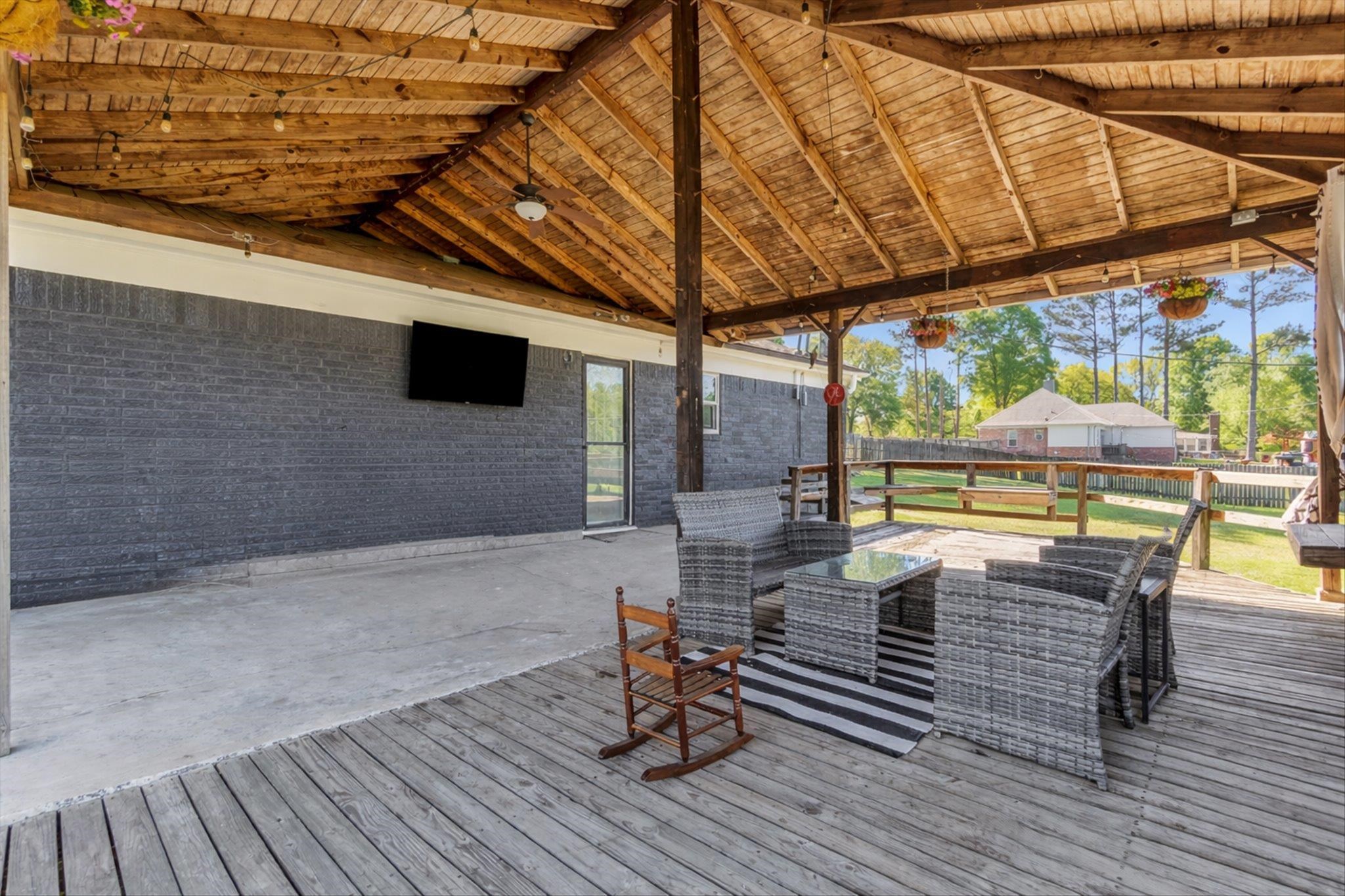 885 Rebel Road Piperton, TN 38017 - Photo 26 of 30 Wooden terrace featuring an outdoor living space and a patio area
