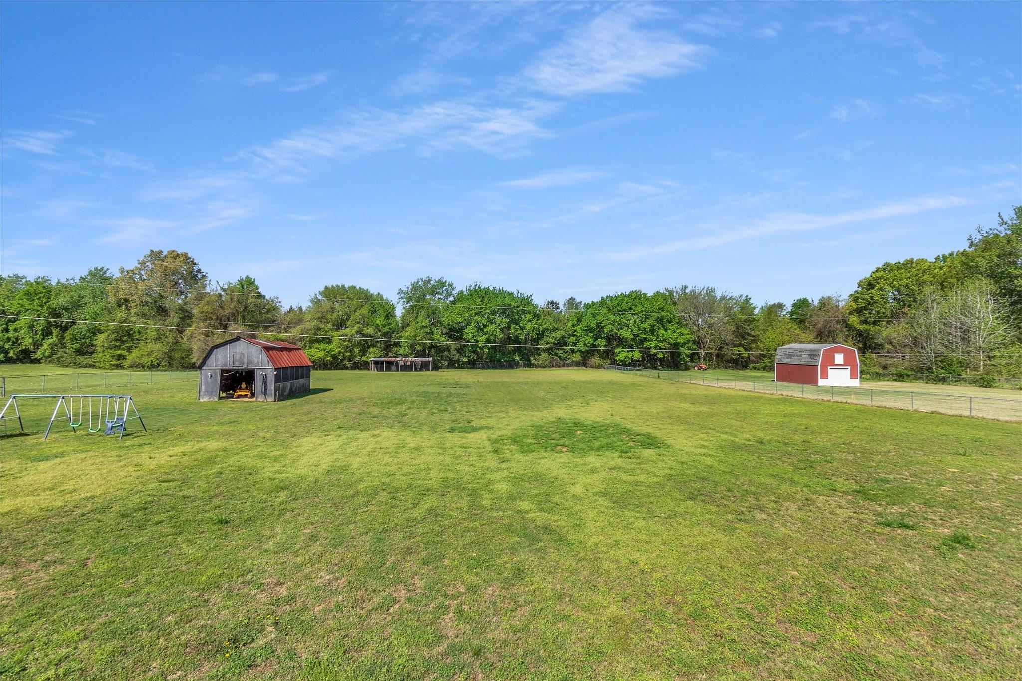 885 Rebel Road Piperton, TN 38017 - Photo 27 of 30 View of yard featuring a barn, an outdoor structure, and view of wooded area