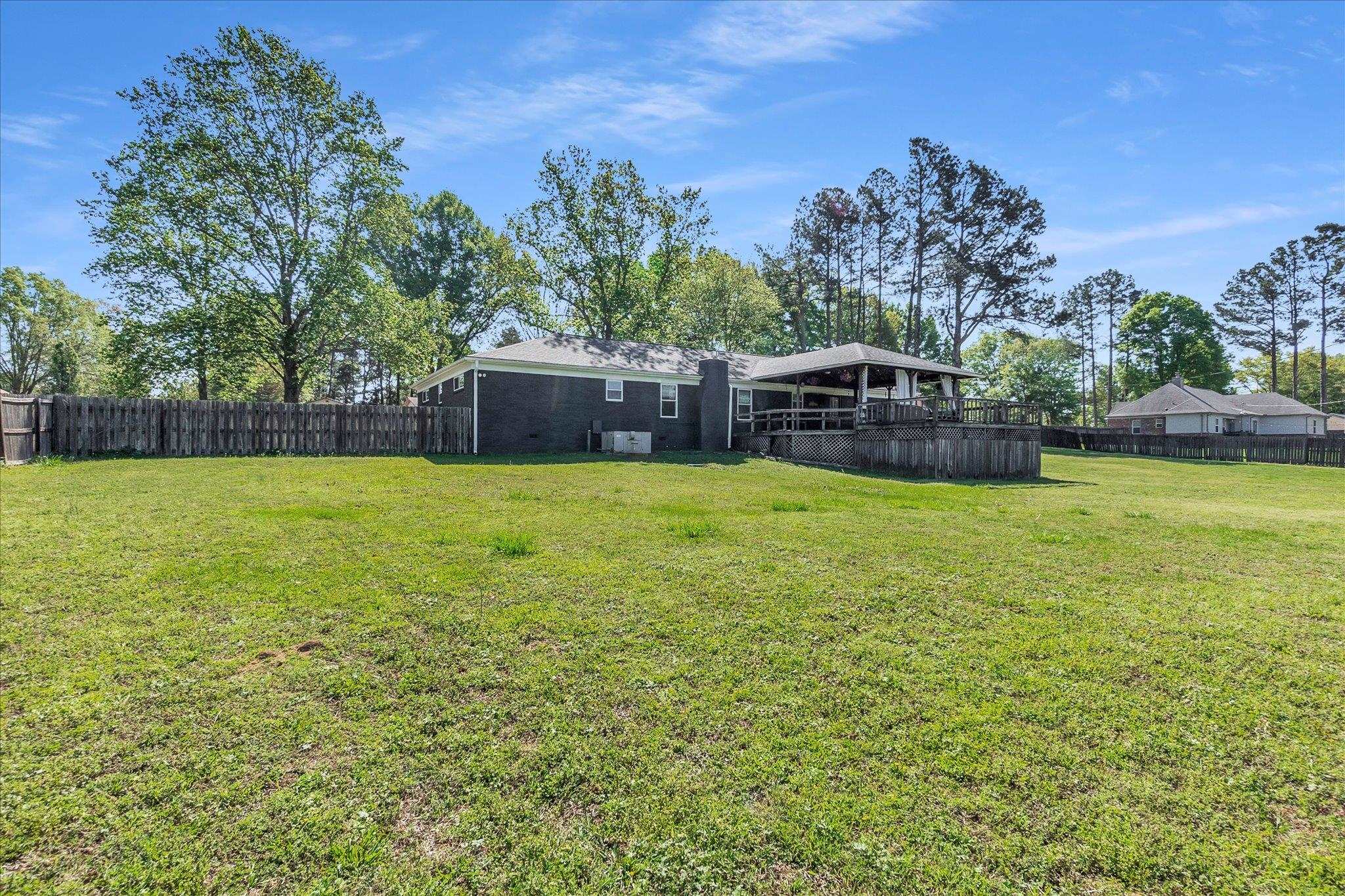 885 Rebel Road Piperton, TN 38017 - Photo 29 of 30 Back of house featuring a fenced backyard and brick siding