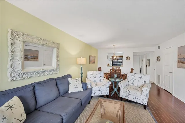 a kitchen with a stove sink and cabinets