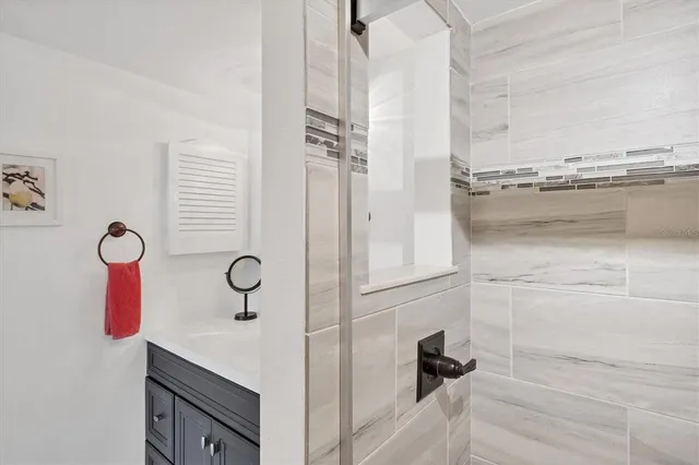 a front view of a house with a yard and a lot of flower plants