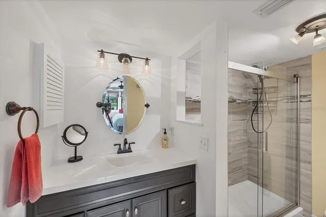 a front view of a house with yard and green space