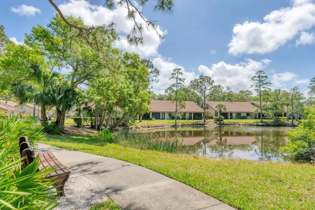 a swimming pool with outdoor seating and yard