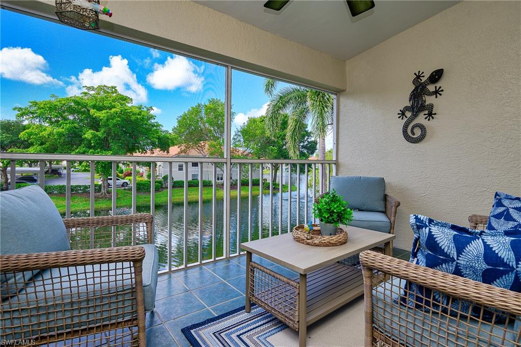 a view of a balcony with furniture