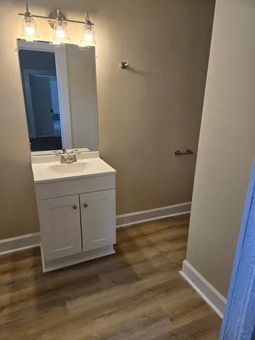 a room with a sink and a mirror