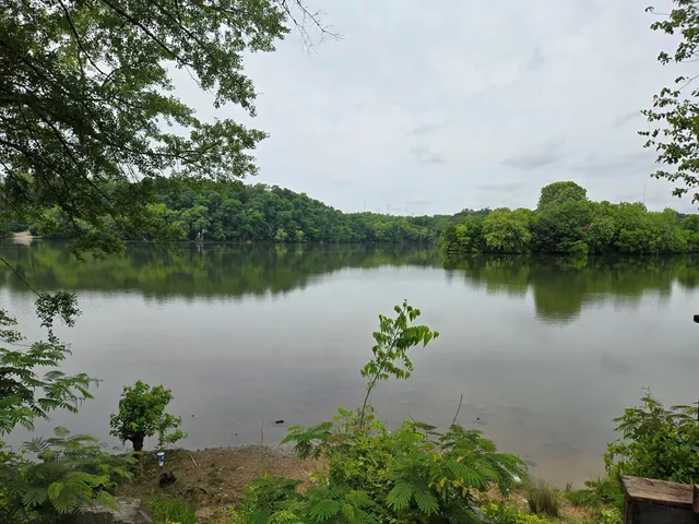 an aerial view of a house with outdoor space and lake view