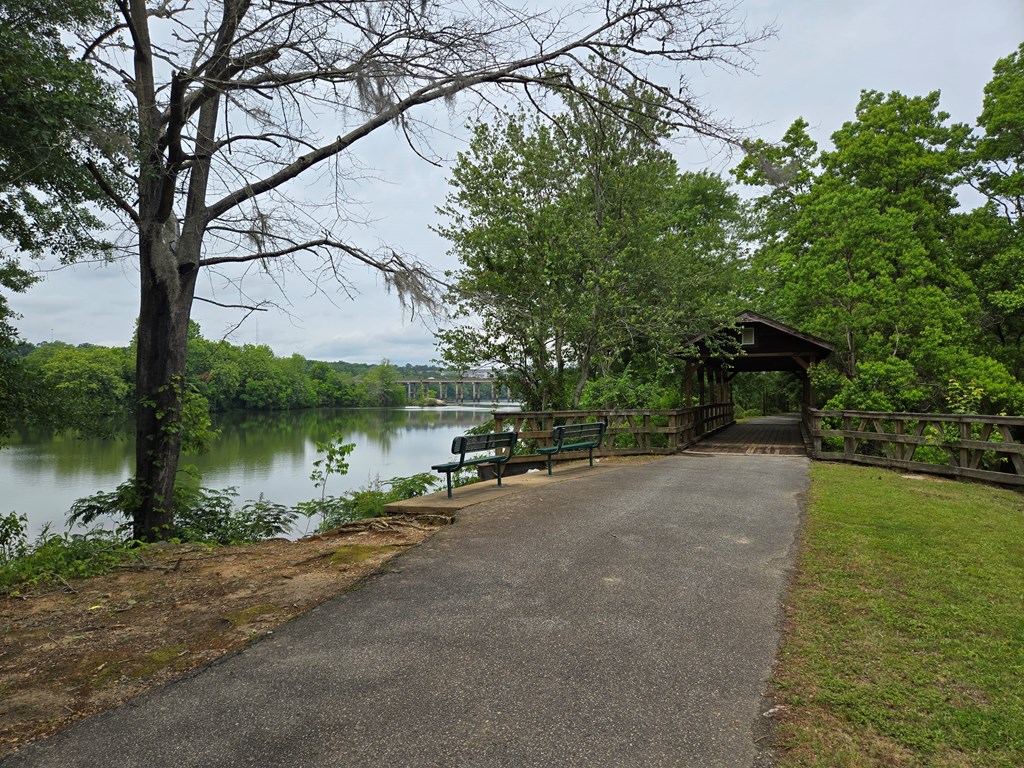 9 Linden Point, Unit B Columbus, GA 31904 - Photo 18 of 18 a view of a lake next to a yard with large trees