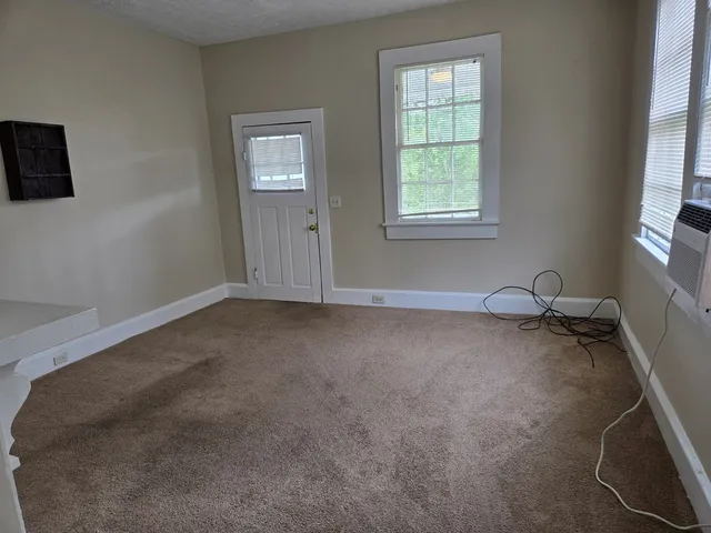 a view of a room that has a window in it