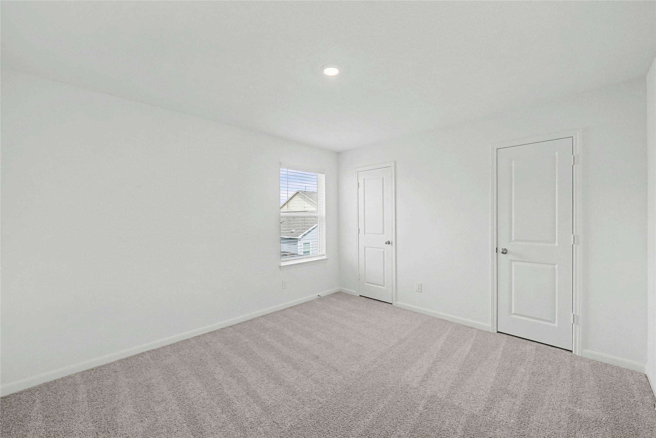 237 Fairlawn Way Maxwell, TX 78656 - Photo 10 of 12 This room features light gray carpet, white walls, and a window with white blinds