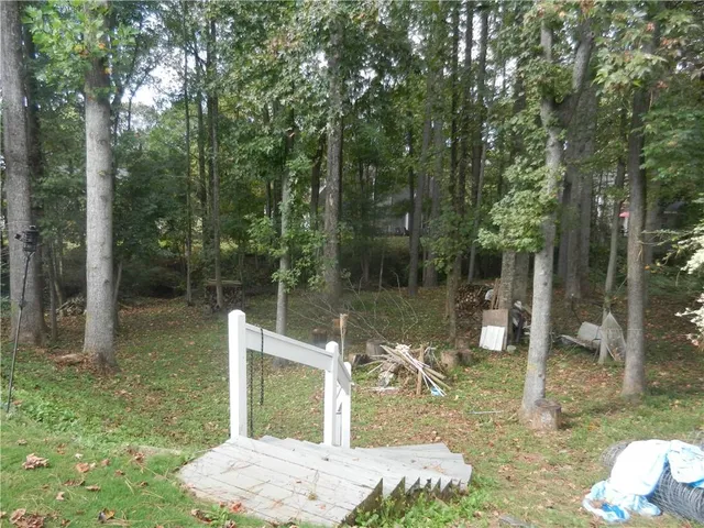 a backyard of a house with lots of green space