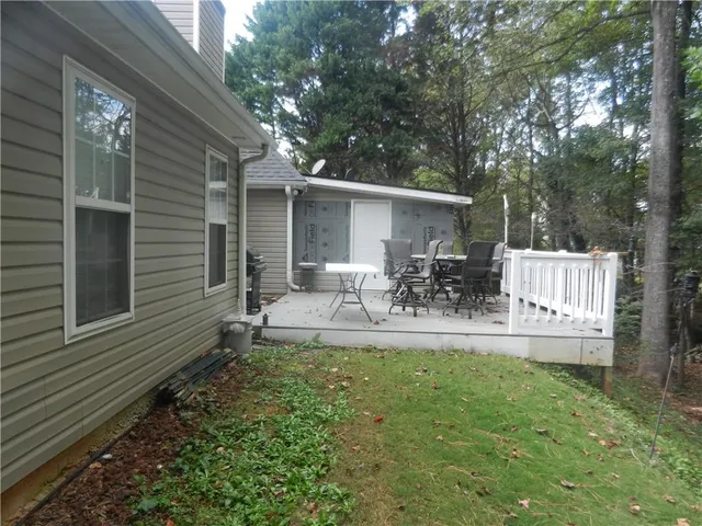 a house view with a sitting space and garden