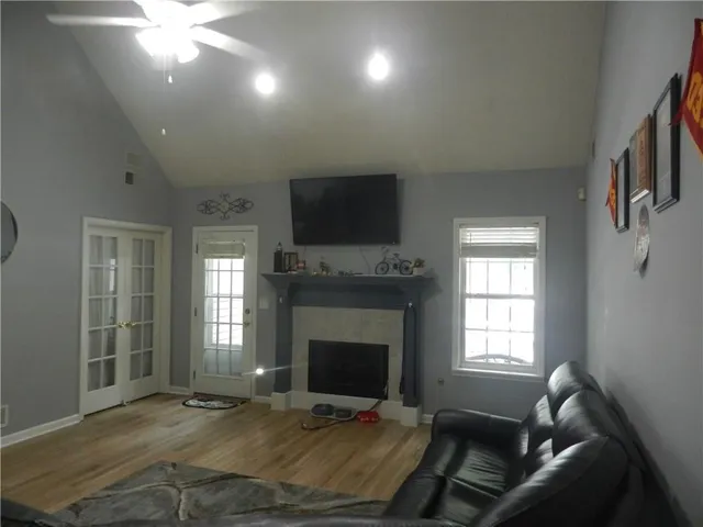 a living room with furniture and a fireplace