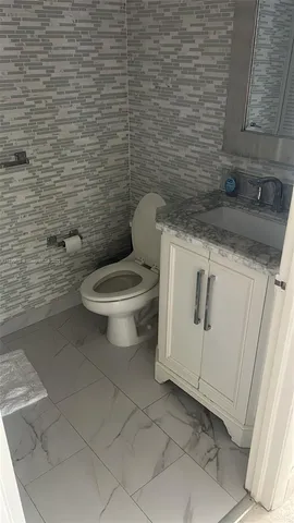a bathroom with a toilet and a sink