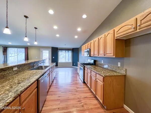 a view of room with window and wooden floor