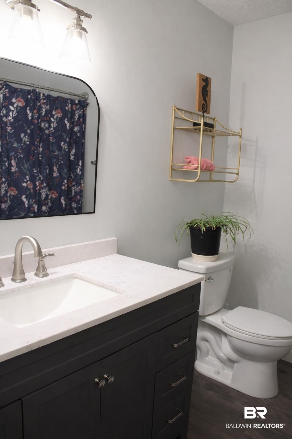 2538 Old Castleberry Road Brewton, AL 36426 - Photo 8 of 12 Full bath featuring vanity, a shower with curtain, dark wood finished floors, and a textured ceiling