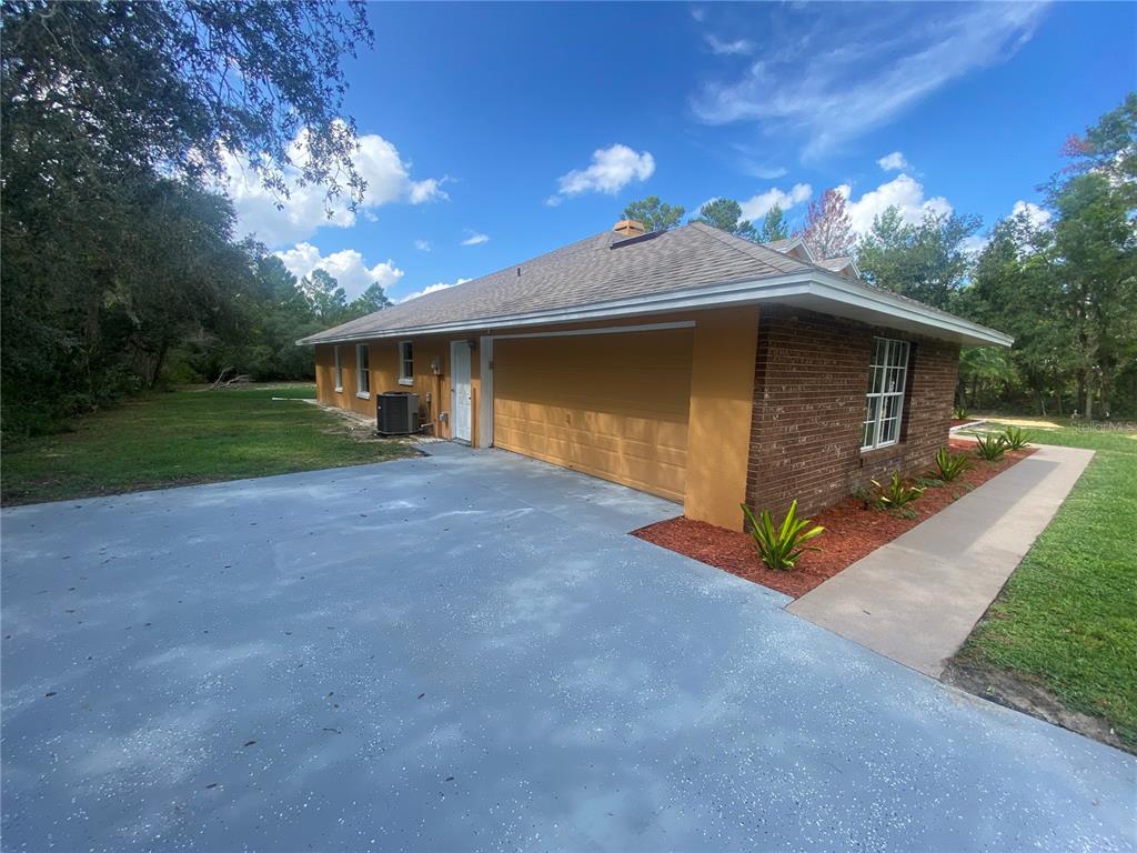 910 Walk In Water Road Lake Wales, FL 33898 - Photo 4 of 29 GARAGE FRONT